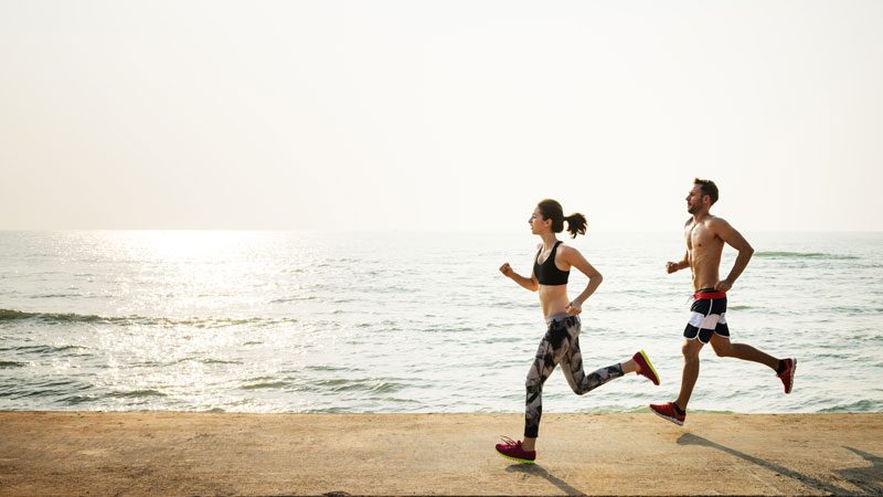 A couple jogging on the beach