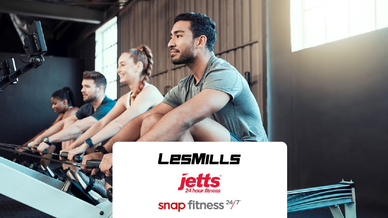 People rowing in a gym