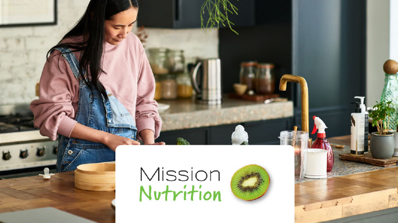 A person prepares healthy food in the kitchen