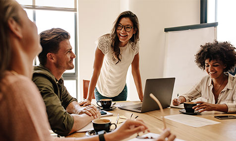 Smiling people at a team meeting