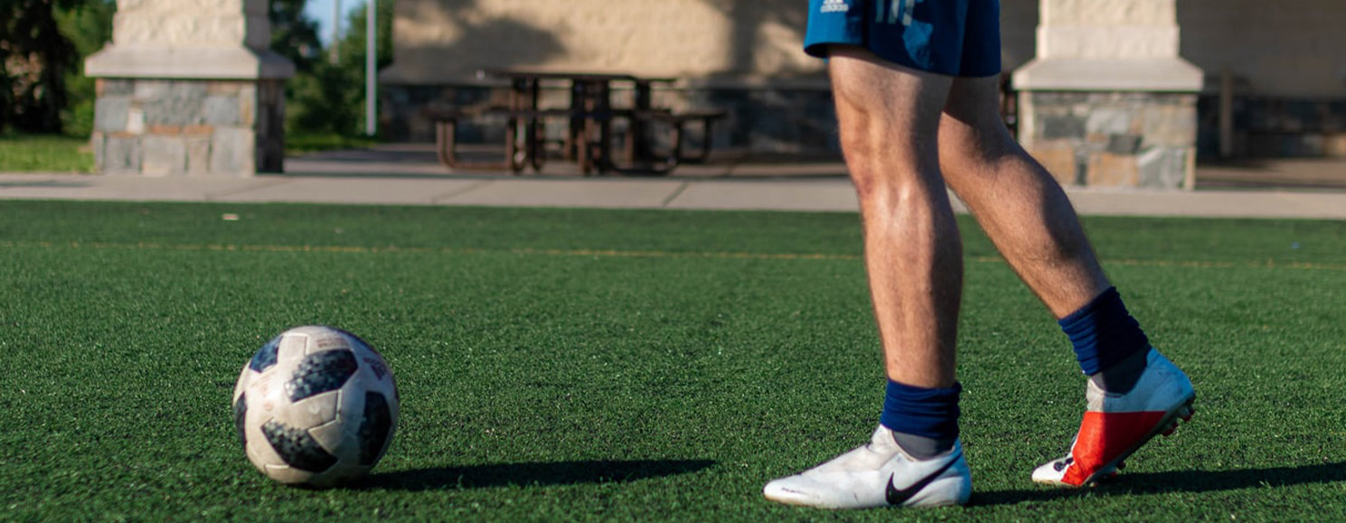Stock image: Soccer player's feet and ball