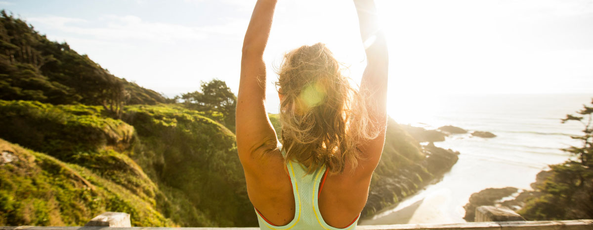 A jogger enjoys the sun and seaside