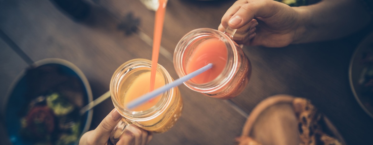People holding healthy-looking drinks