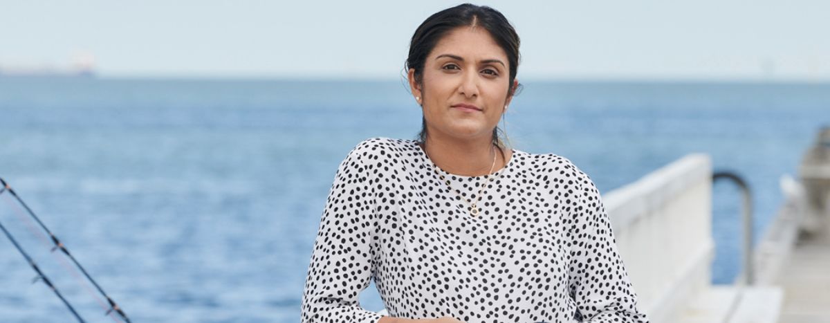 Dr Preeya Alexander poses by the seaside
