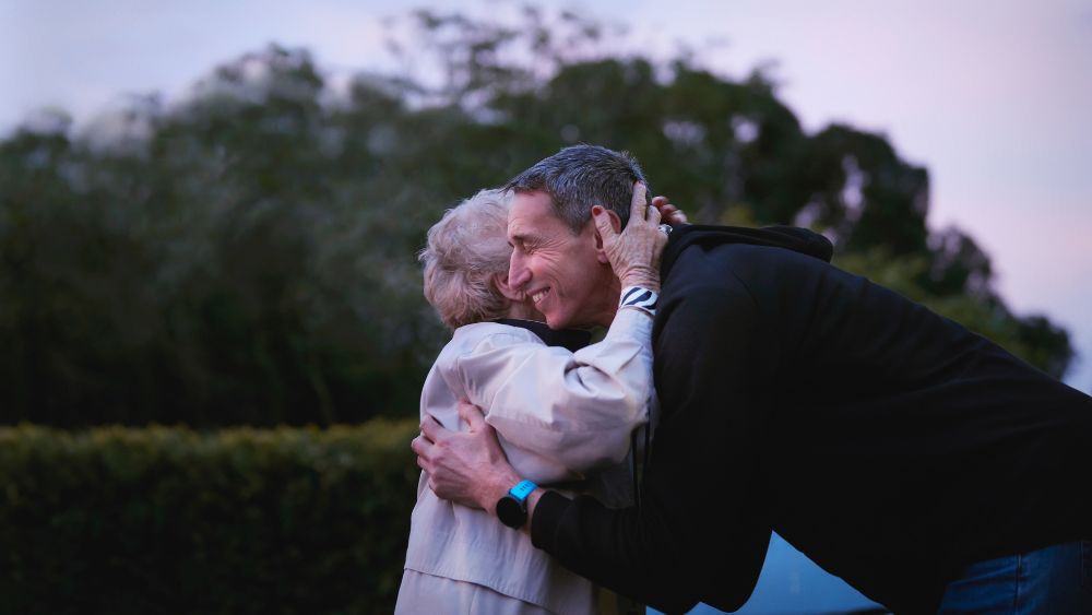 AIA Vitality Ambassador Ian Jones embracing another person