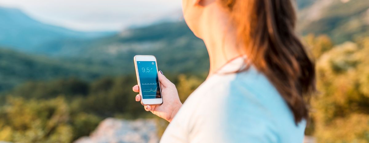 AIA Vitality | Move more to manage diabetes | image of person holding phone that is measuring blood glucose levels