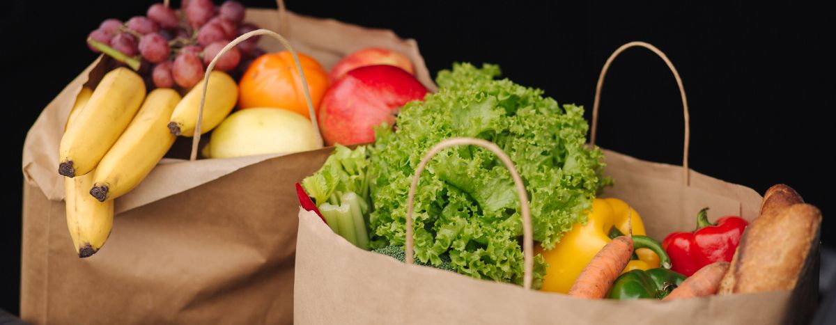 AIA Vitality x Heart Foundation | How to plan well and stretch your food dollar | Paper bags filled with fresh fruit and vegetables