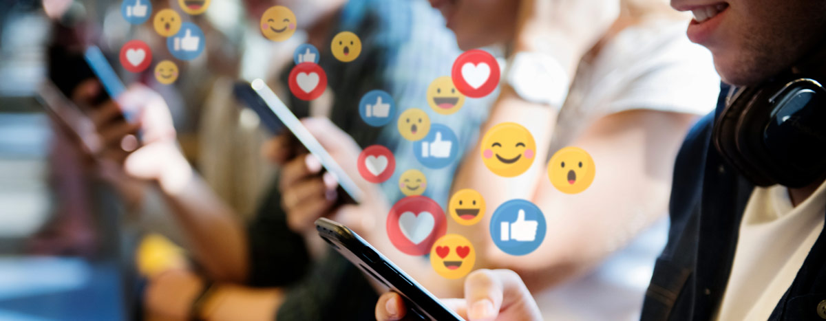 People holding phones with reaction icons