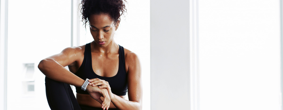 Woman checks her smartwatch