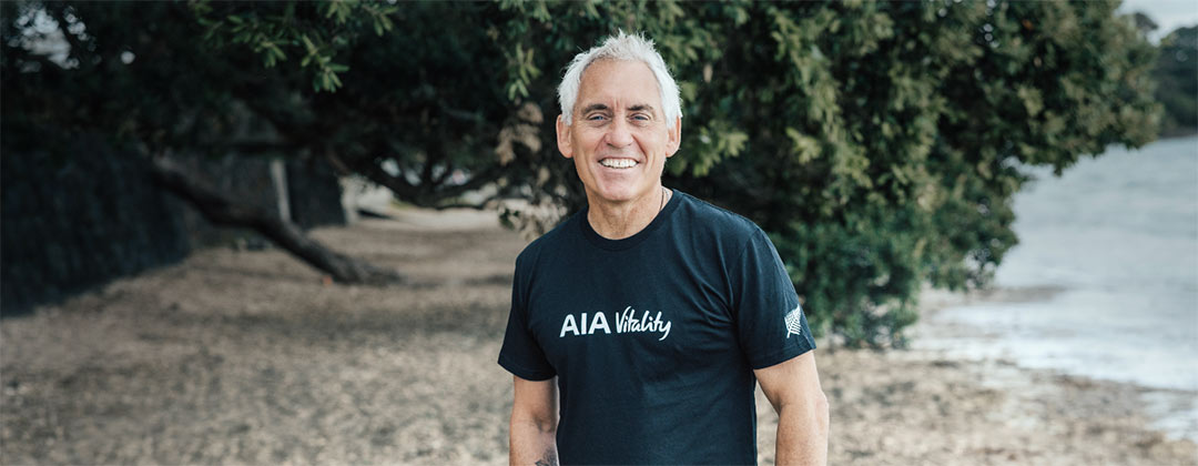 Jason Gunn at the sea-side in AIA Vitality shirt