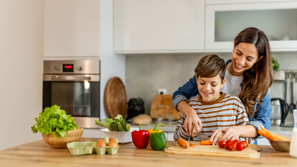 Mother and son preparing healthy meal