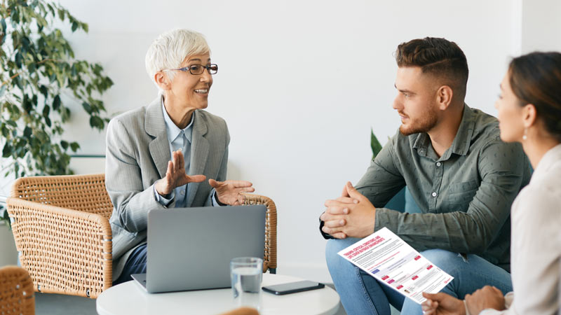 Financial adviser meets with clients